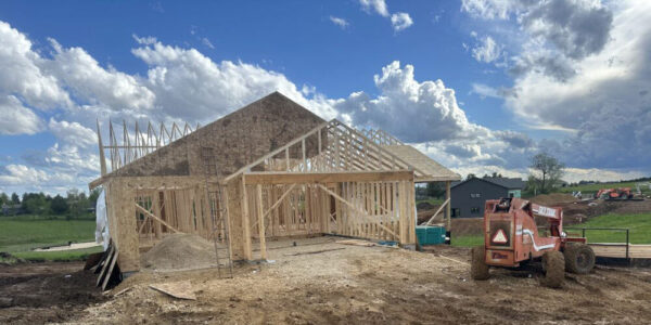 title-contracting wood framing of house being built